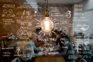 E-marketing concept. Hipster lightbulb with chalk marketing strategy superimposed on top of it.