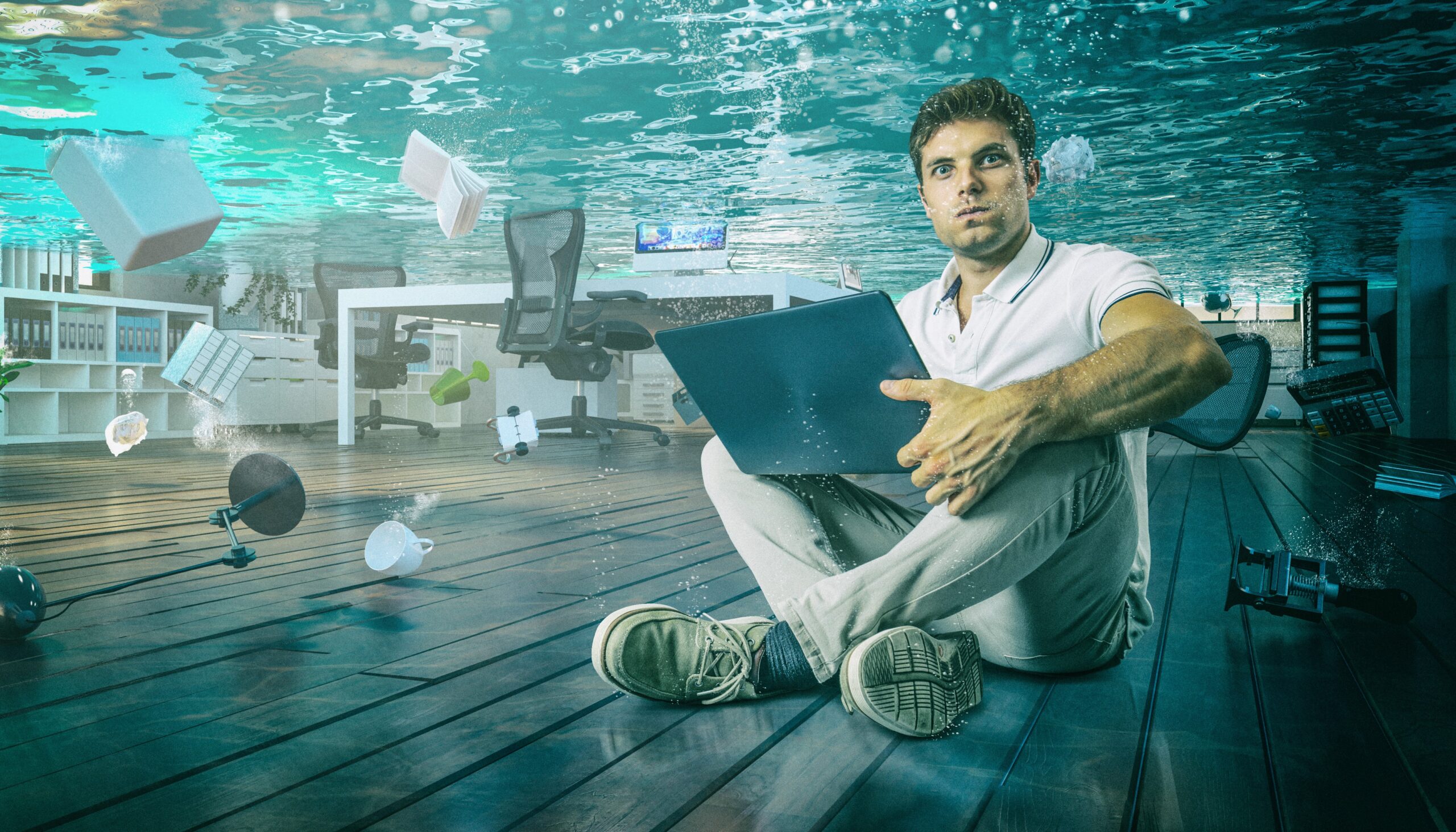 Float concept. Office worker with laptop looking surprised at being underwater