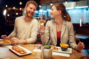 Deals of the Week: couple enjoying dinner at a restaurant