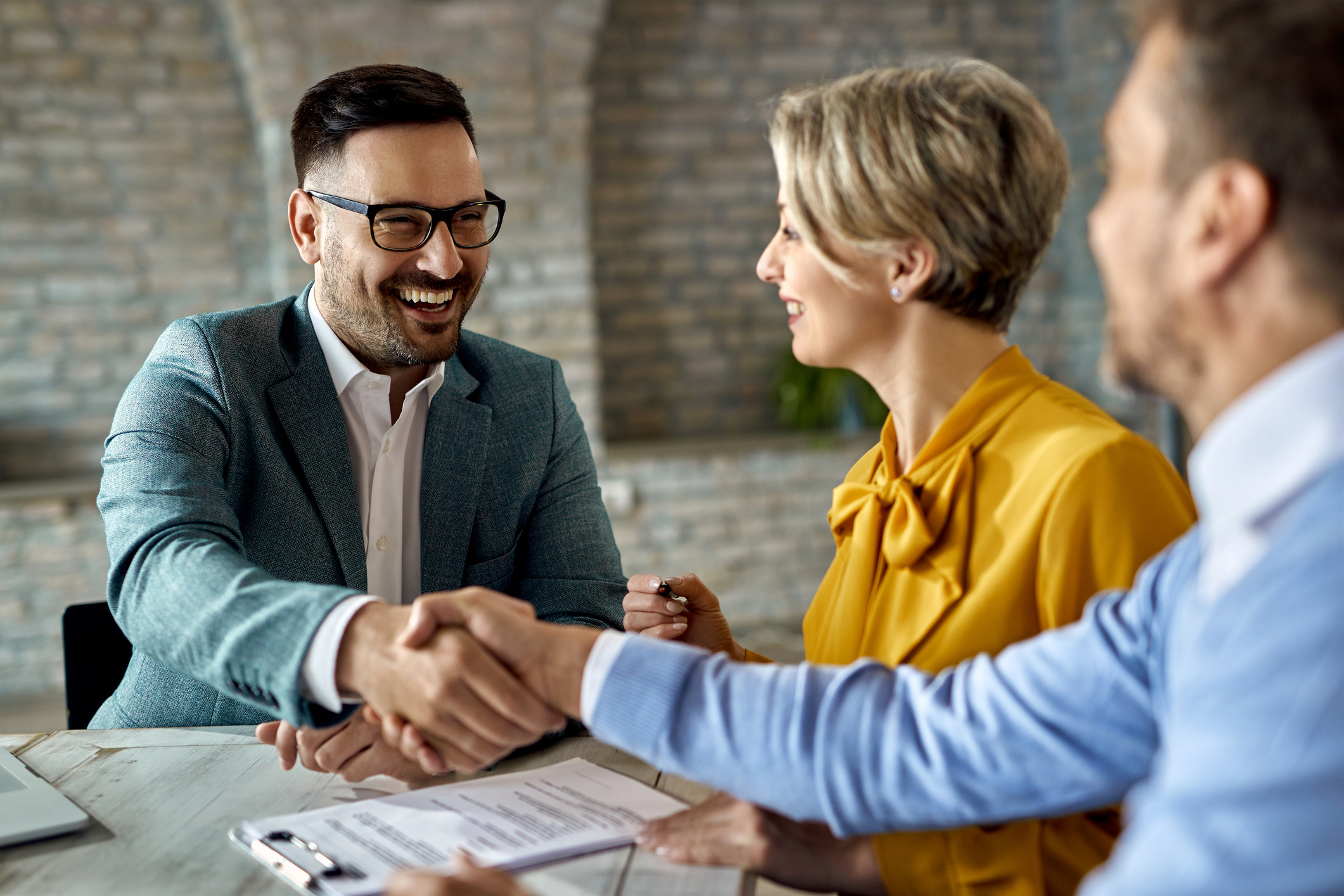 Angel investor shaking hands with founder