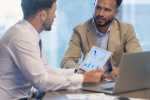 Business owner and consultant discussing funding options