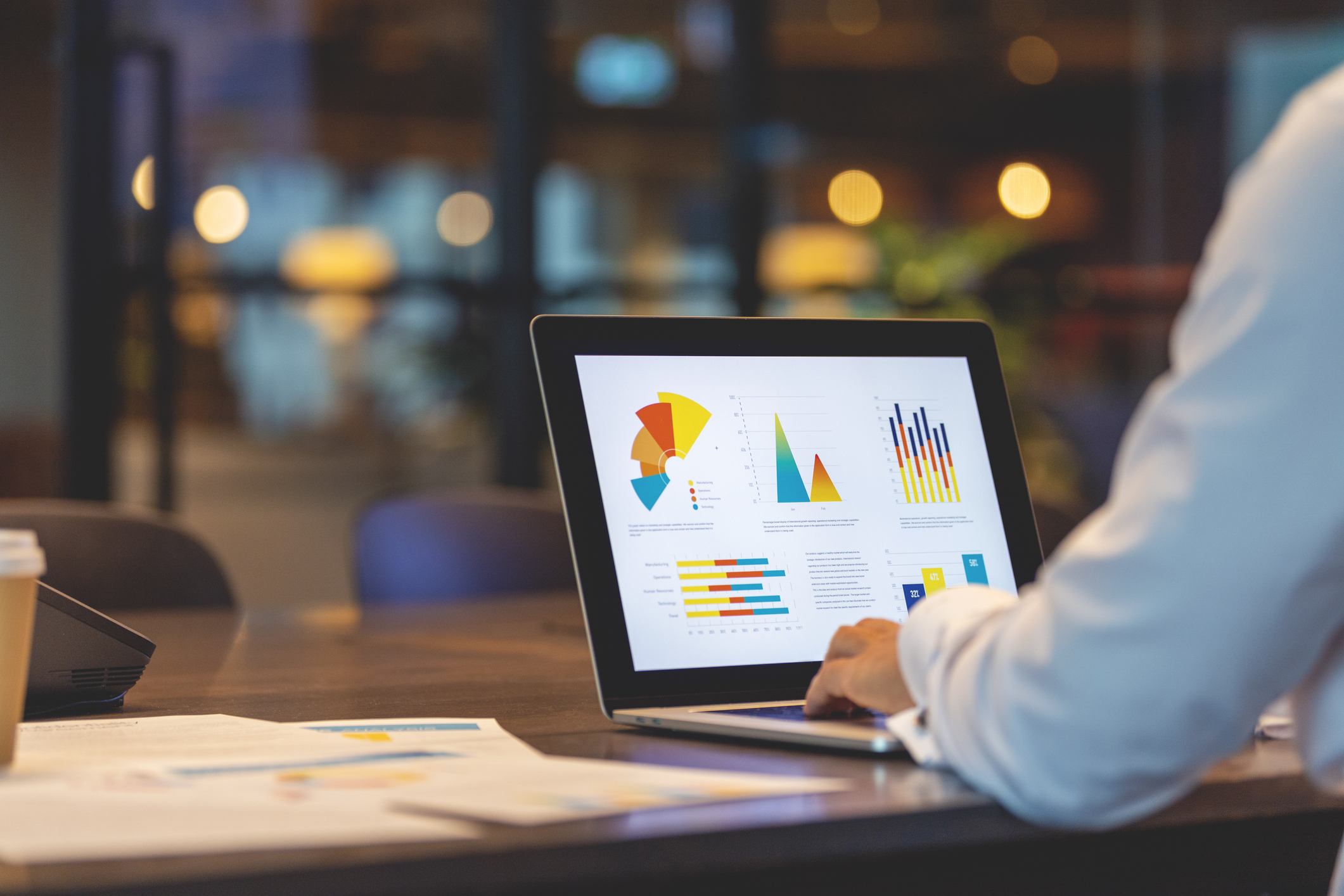 Accountant looking at graphs on a screen